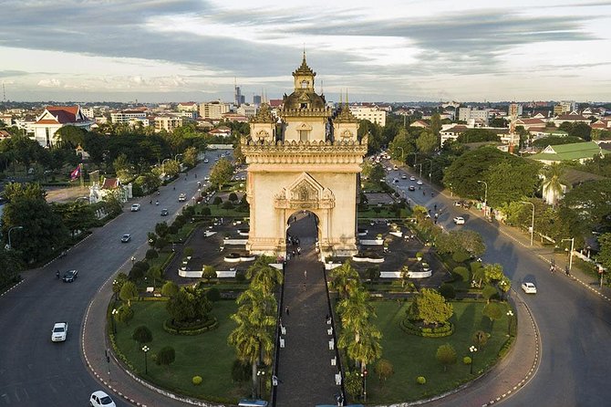 Guided Vientiane City and Buddha Park Full-Day Tour - Climbing Patuxai for a wider view of Vientiane