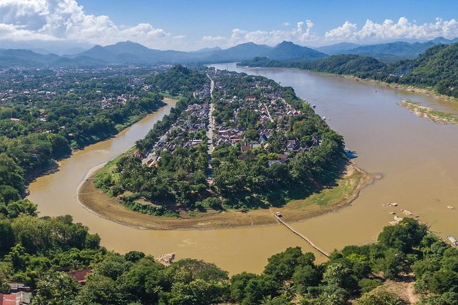 Luang Prabang City Tour & Kuang Si Waterfalls - Starting before sunrise at the alms ceremony