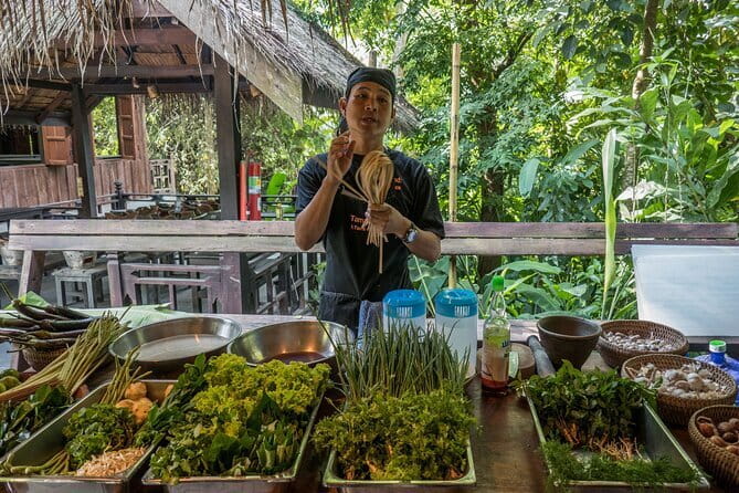 Luang Prabang Cooking, Pottery & Candle Experience - Making candles with flowers and beeswax