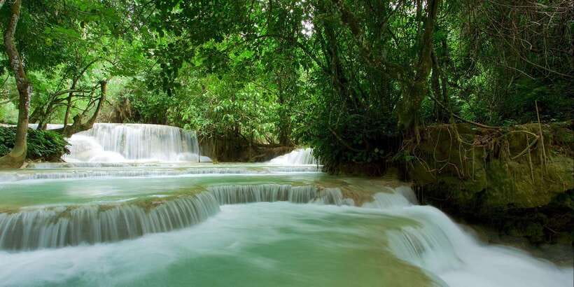 Luang Prabang: Kuang Si Bike Ride & Long-Tail Boat Cruise - Arriving at Kuang Si Falls