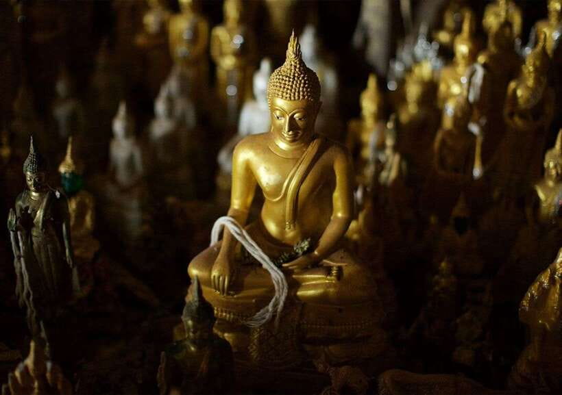 Luang Prabang: Pak Ou Caves & Kuang Si Falls Day Trip - Inside Pak Ou Caves, statues and incense