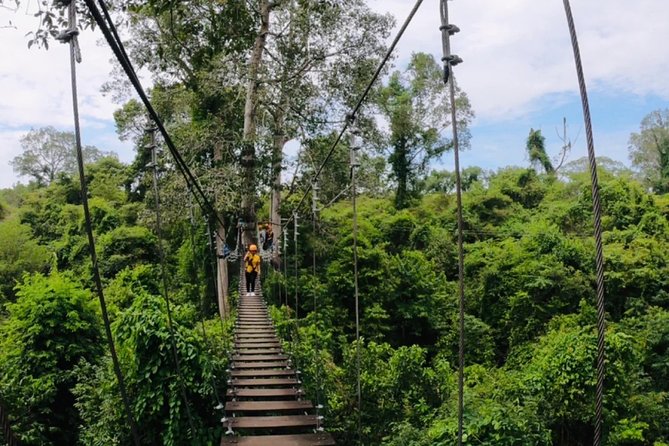 One Day Guided Tour: Kayaking, Zipline & Tubing In The Cave from Vang Vieng - Farm paths, forest, and the zipline finish