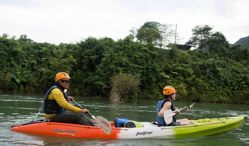 Vang Vieng: Kayaking & Cave Tubing with Zip Line/Blue Lagoon - Kayaking the Nam Song from a Khmu village