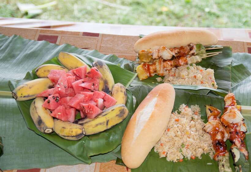 Vang Vieng: Tham Nangfar and Tham Nam Day Tour with Kayaking - Banana-leaf BBQ lunch beside the Nam Song